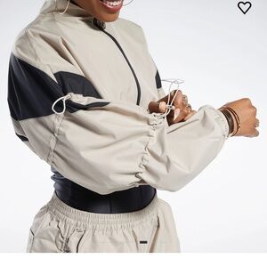 CARDI'S VERSION OF A REEBOK CROPPED TRACK JACKET
